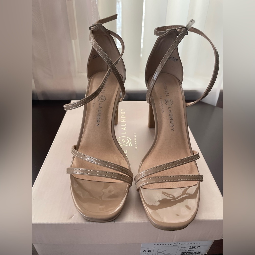 Beige open toe heels.